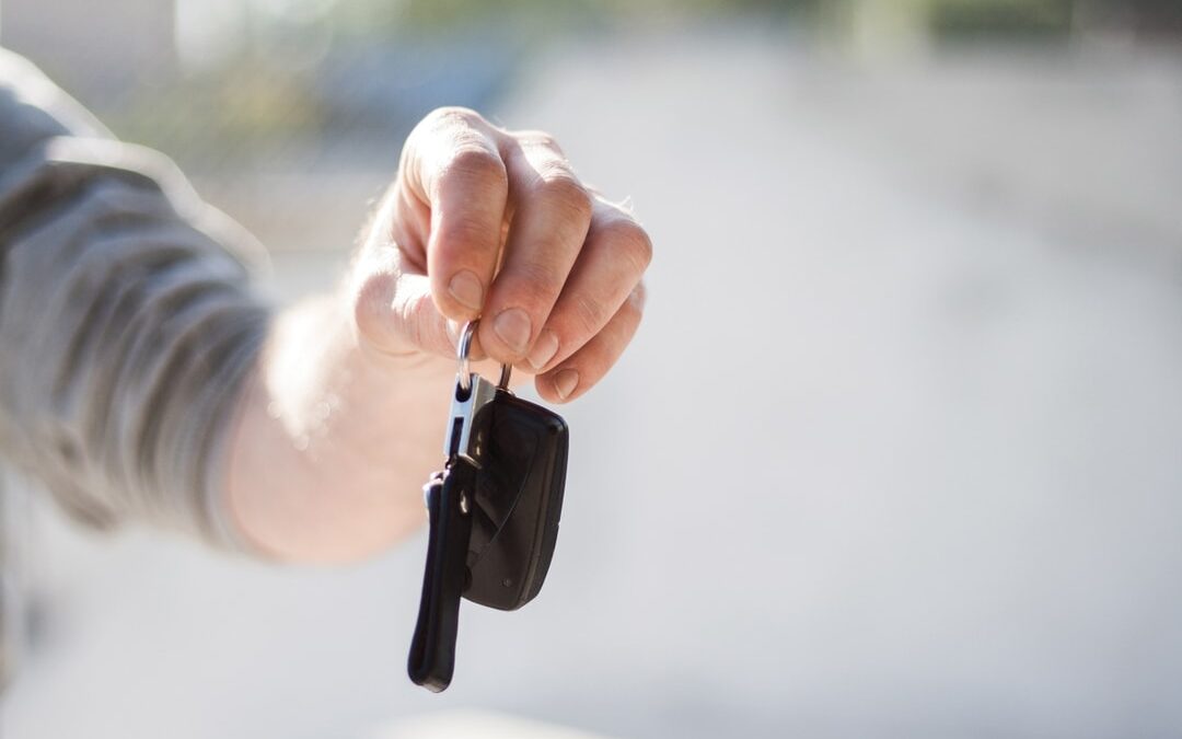 White man's hand holding keys