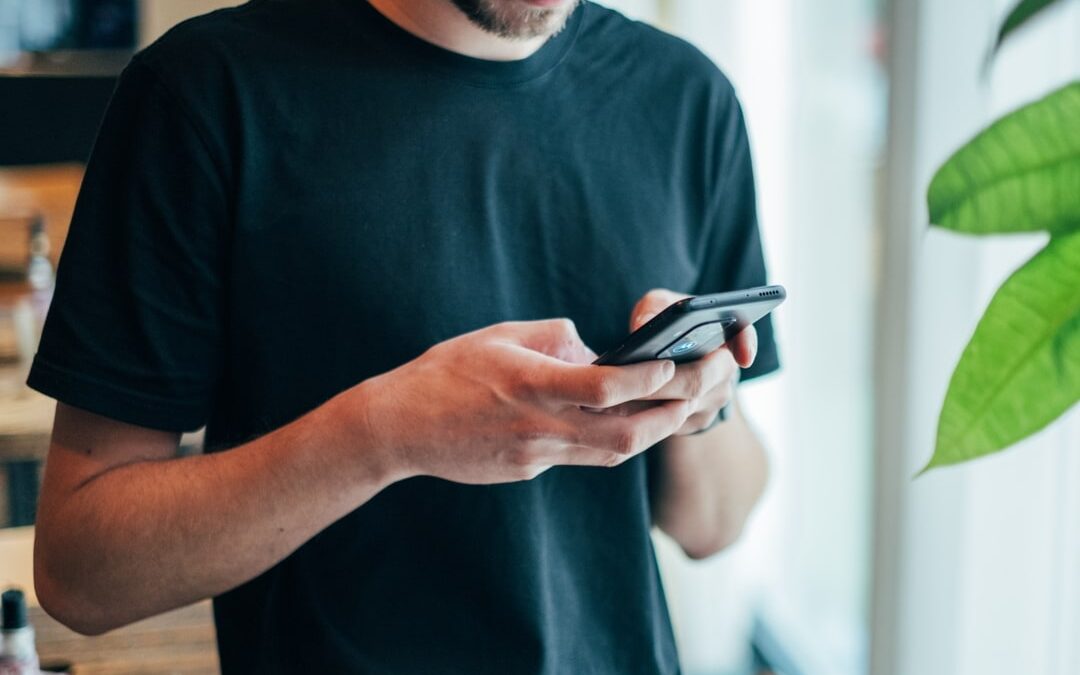 White man looking at smart phone