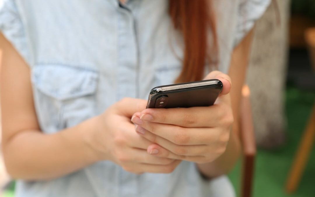 White woman using smart phone